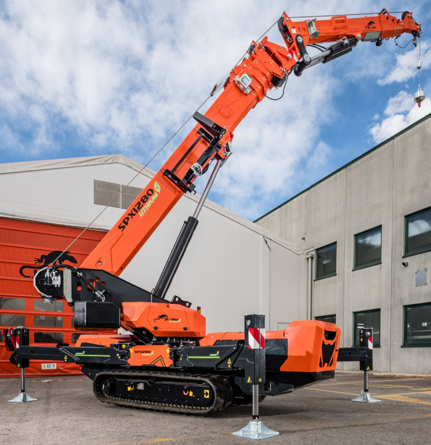 Mobile Crane lifting heavy construction materials at a commercial building site. Industrial crane equipment in action under the blue sky with some clouds. Safe rigging, heavy lifting, and construction machinery at work.